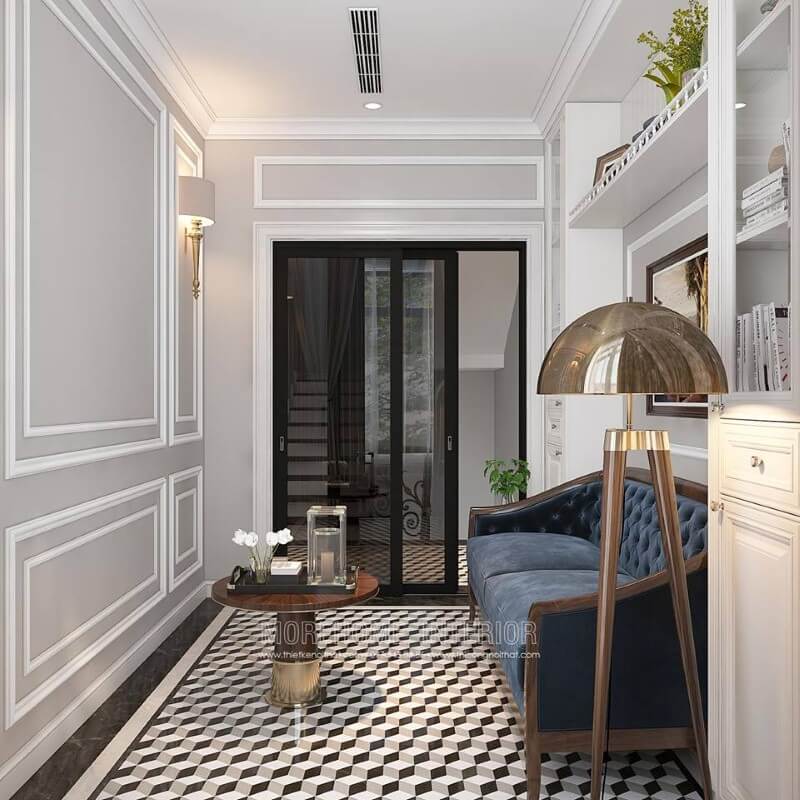 Gạch lát nền giả cổ, sofa văng gỗ óc chó tân cổ điển bọc nệm xanh cùng tường trắng đơn sắc đã tạo nên không gian đẹp sang trọng, đáp ứng tối đa công năng cho phòng đọc sách. Thiết kế nội thất