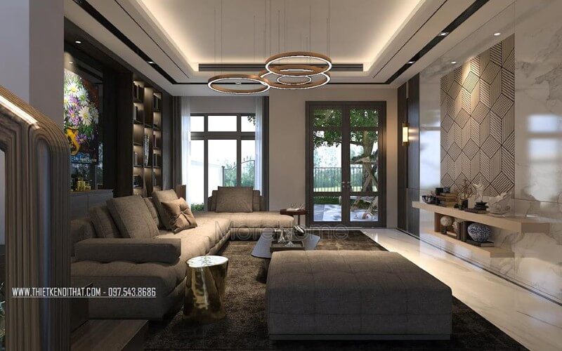 Thiết kế nội thất phòng khách ấn tượng với cách kết hợp hài hòa giữa sắc trầm và sáng cùng hệ cửa kính lớn giúp không gian trở nên thông thoáng, sang trọng. Thiết kế nội thất