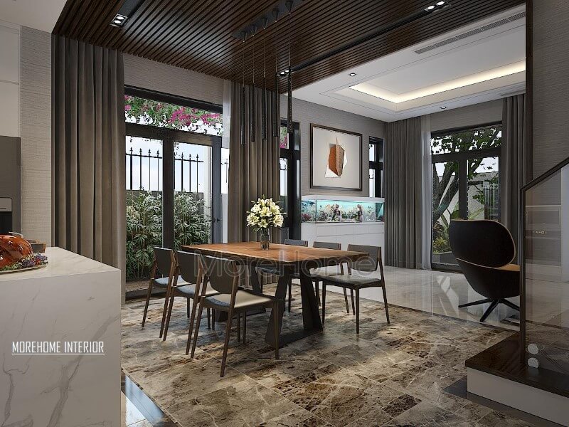 Trang trí phòng ăn hiện đại thông thoáng, chan hòa với thiên nhiên từ hệ cửa lớn giúp ánh sáng lan tỏa tối đa nhưng vẫn chắn nắng kịp thời từ rèm 2 lớp. Thiết kế nội thất